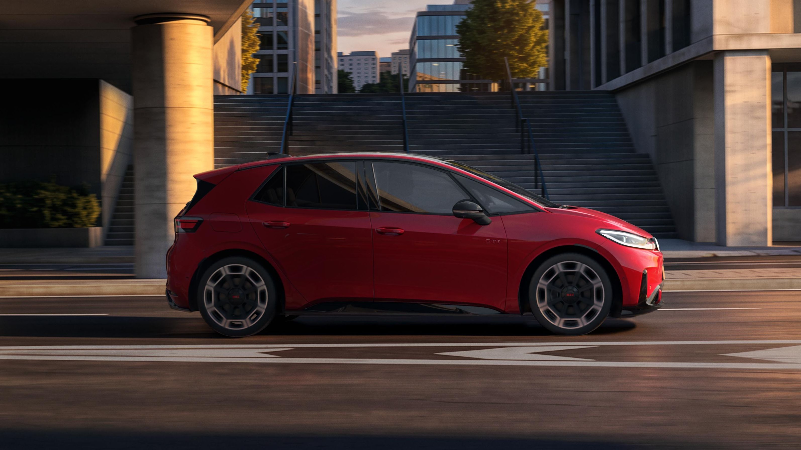 [AI-modified] – Boční pohled na červený VW ID.3 GTI projíždějící pod mostem v městském prostředí.